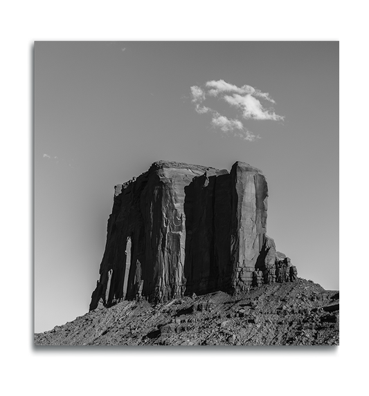 Monumental Valley butte with small patch of clouds above it black and white print on metal