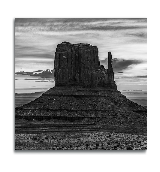 Monument Valley Square Metal Print classic desert butte against dramatically cloudy sky in black and white