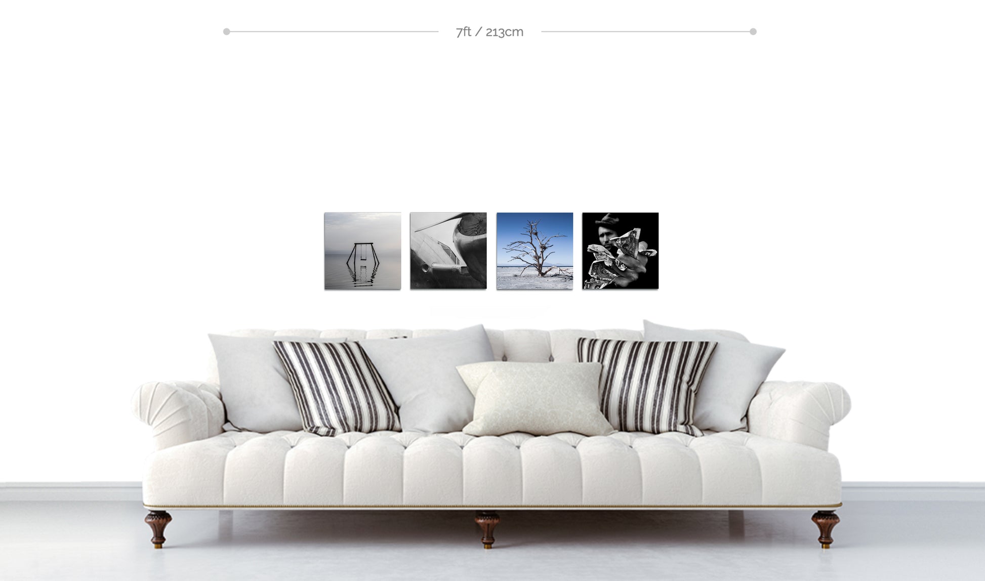 Set of four square metal prints in color and black and white displayed in line formation above sofa