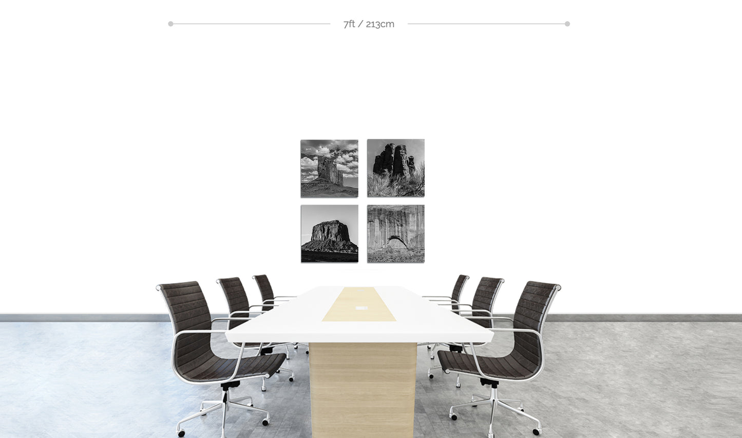 Monument Valley set of 4 Metal Prints arranged in square formation on wall behind boardroom table with chairs