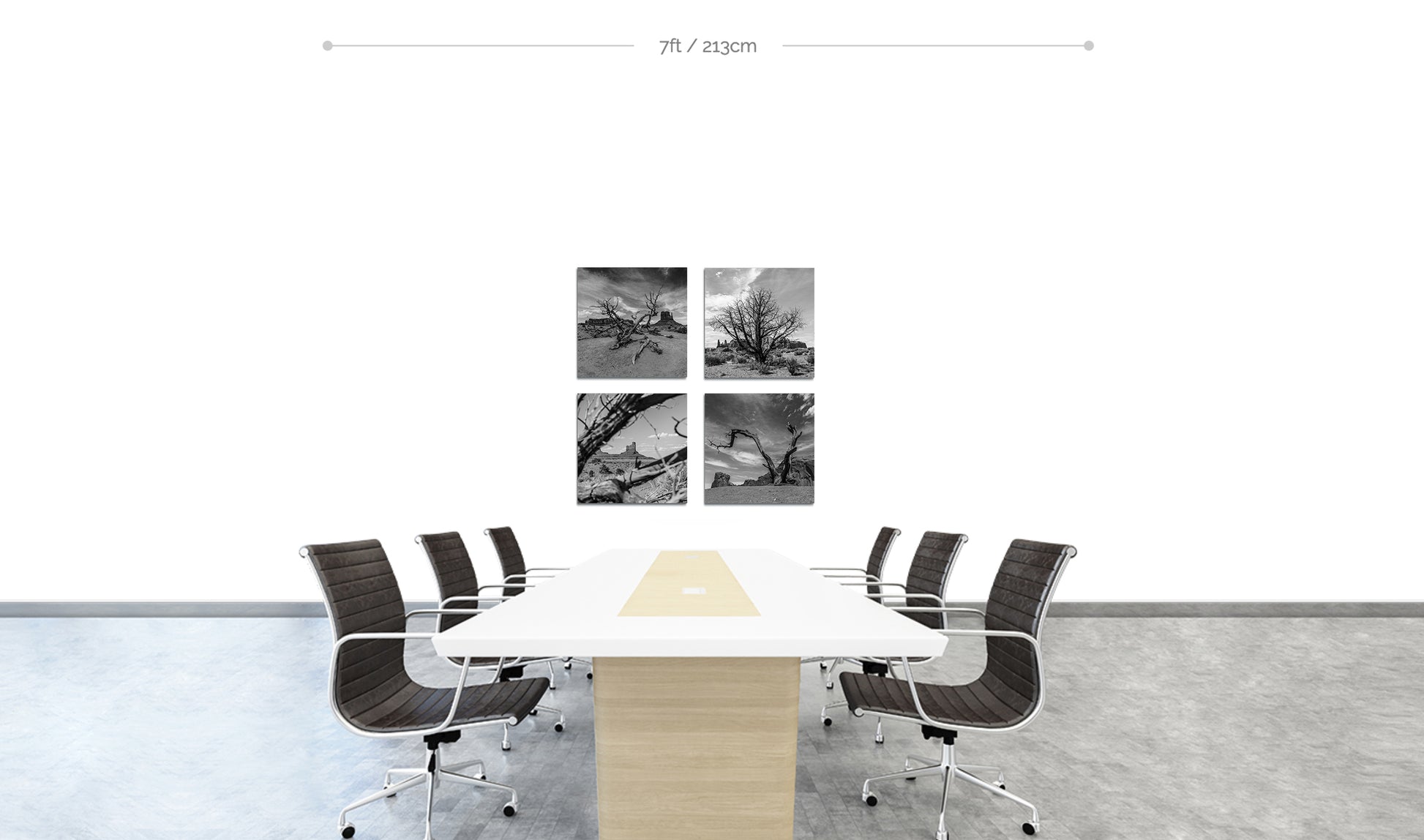 Monument Valley square black and white fine art prints featuring desert trees set of 4 arranged in square formation on wall behind boardroom table with chairs