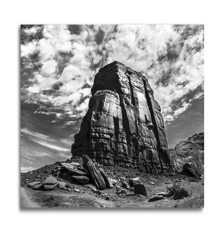 Monument Valley Square Metal Print black and white desert butte against dramatic cloudy sky