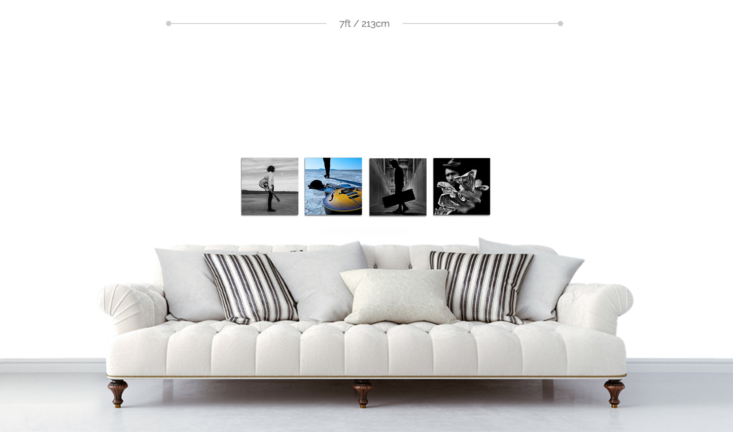 Set of four fine art square metal prints displayed in horizontal line above sofa