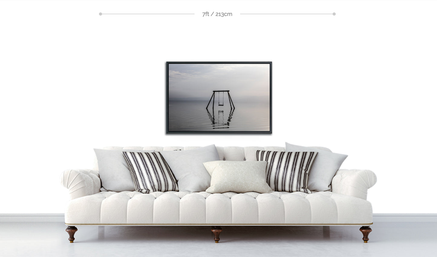 Nautical Disaster print in black and white displayed over sofa on white wall