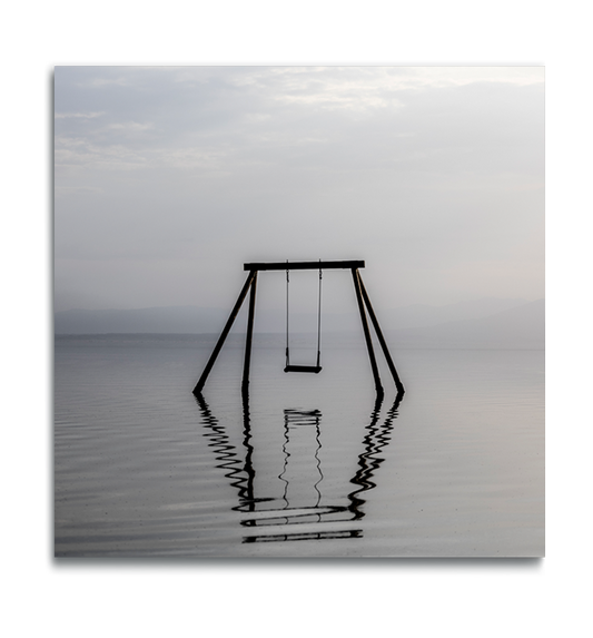 Fine Art color square print on metal swing set immersed in water in muted colors