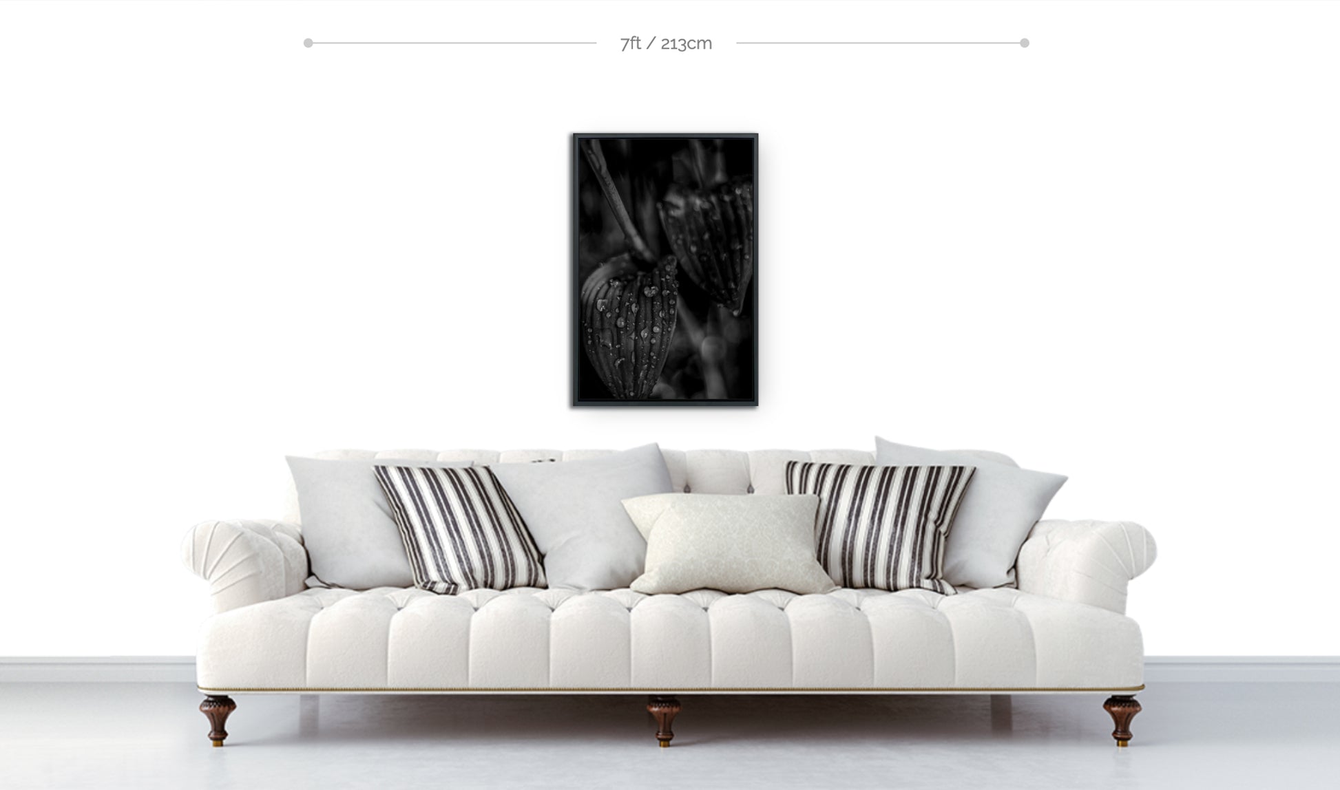 Metal print botanical wall art framed black and white photograph raindrops on leaves handing above sofa